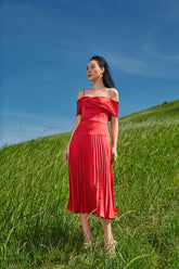 Silk off-shoulder midi dress with pleated skirt and structured bodice for elegant occasions
